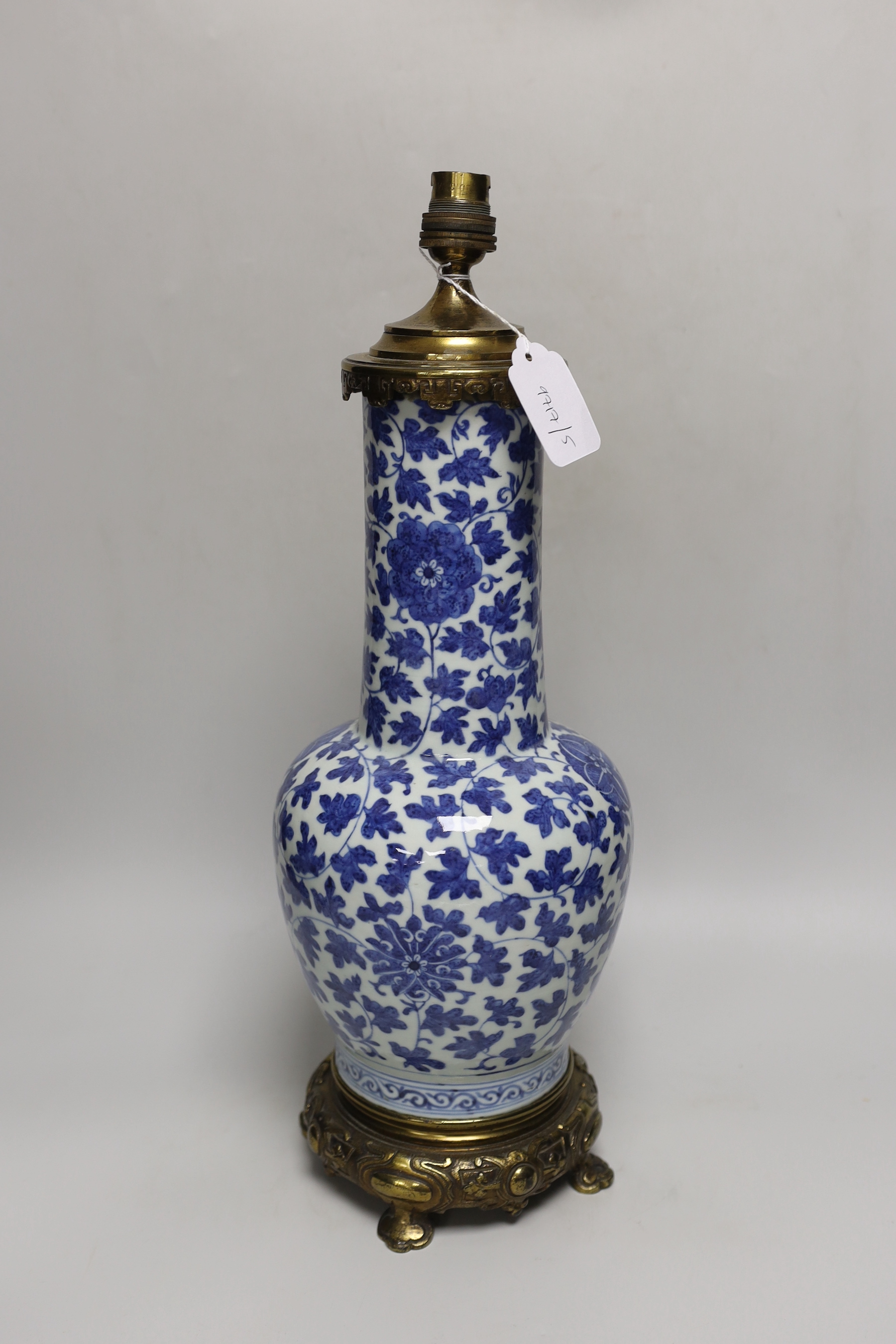 A 19th century Chinese blue and white ‘lotus’ vase, later converted into a brass lamp